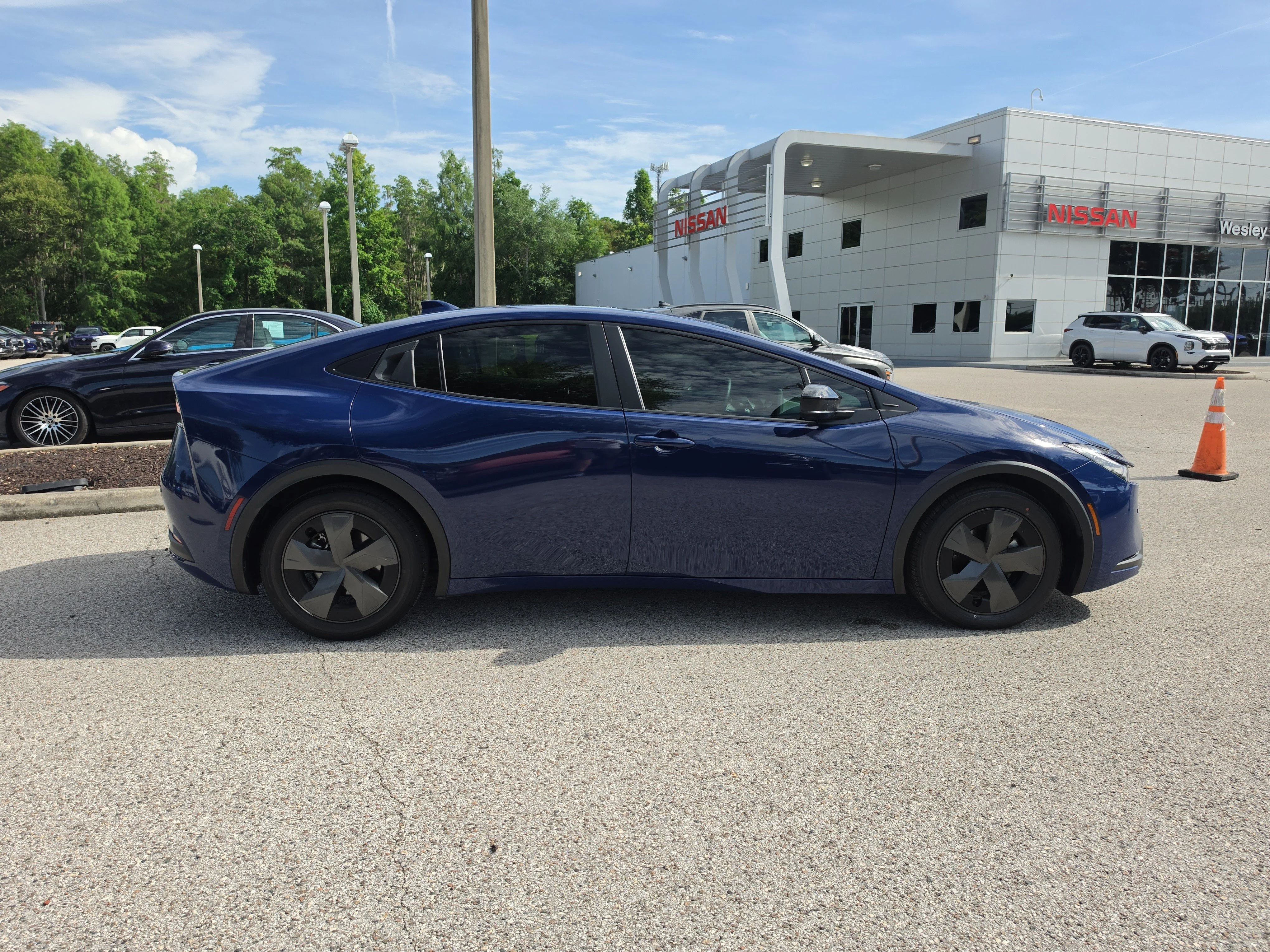 Used 2024 Reservoir Blue Toyota LE image 9