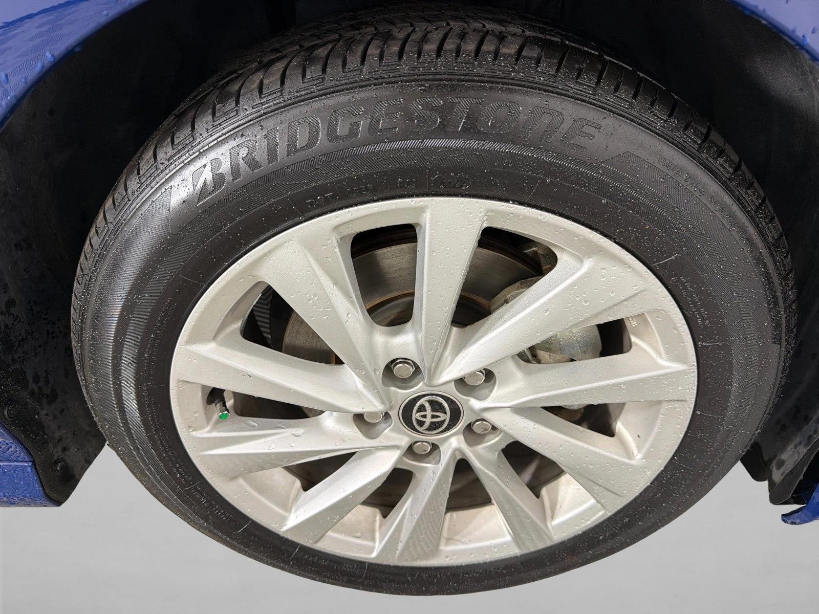 Used 2024 Reservoir Blue Toyota LE image 12