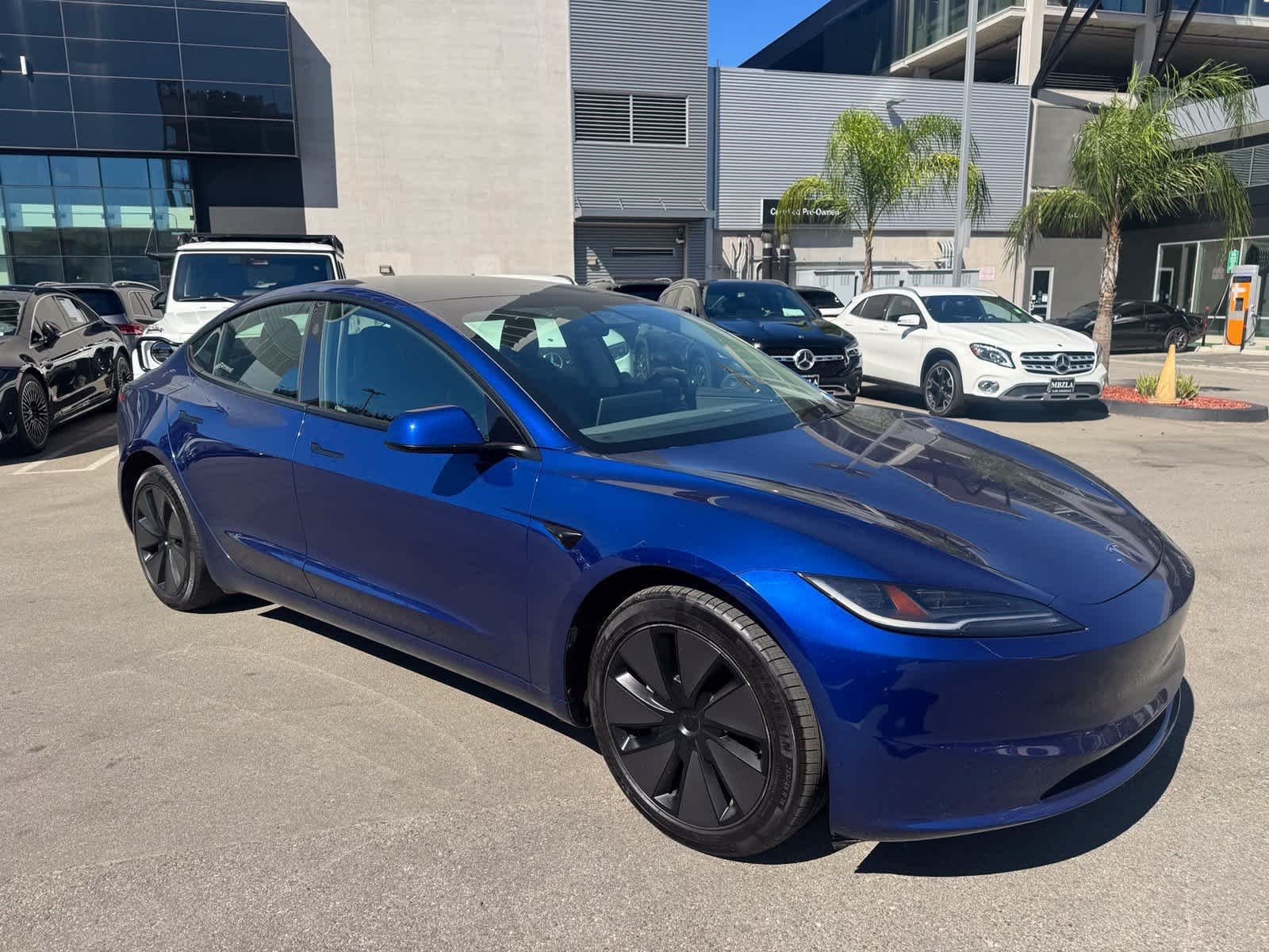 Used 2024 Deep Blue Metallic Tesla  image 2
