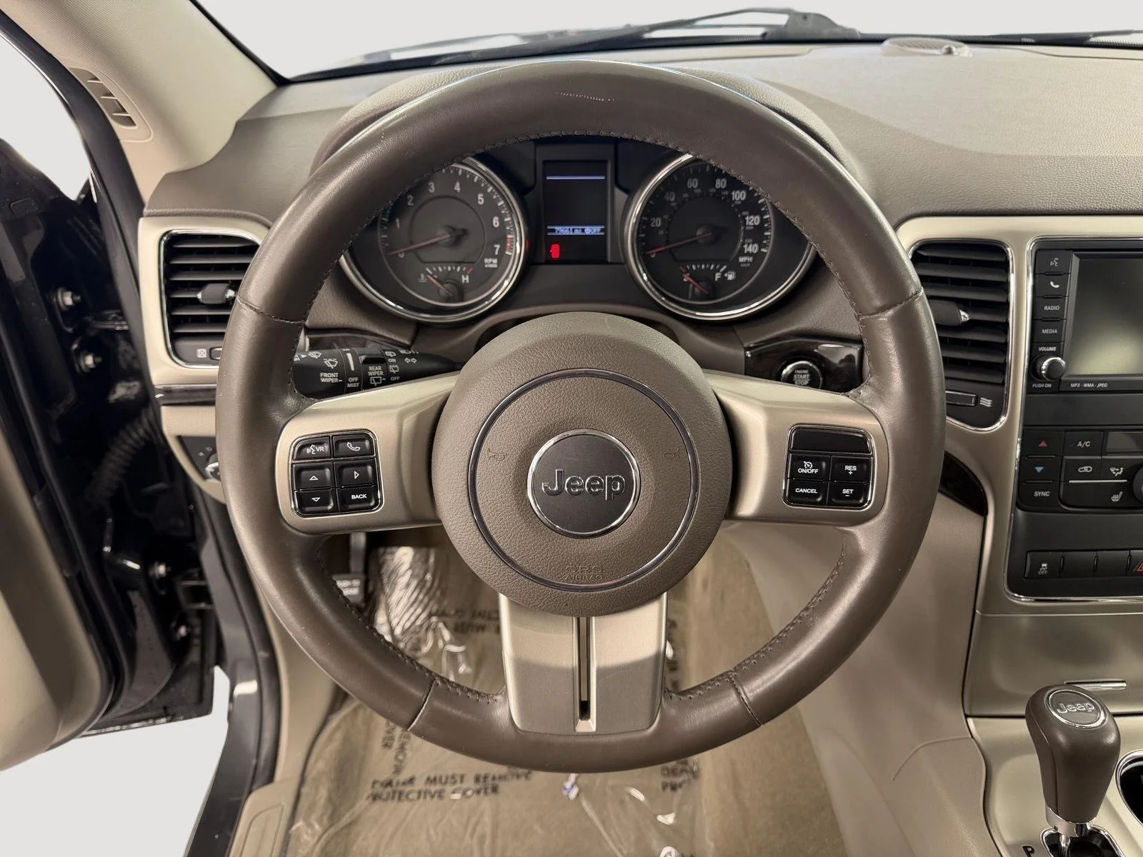Used 2011 Dark Charcoal Pearl Jeep Laredo image 12
