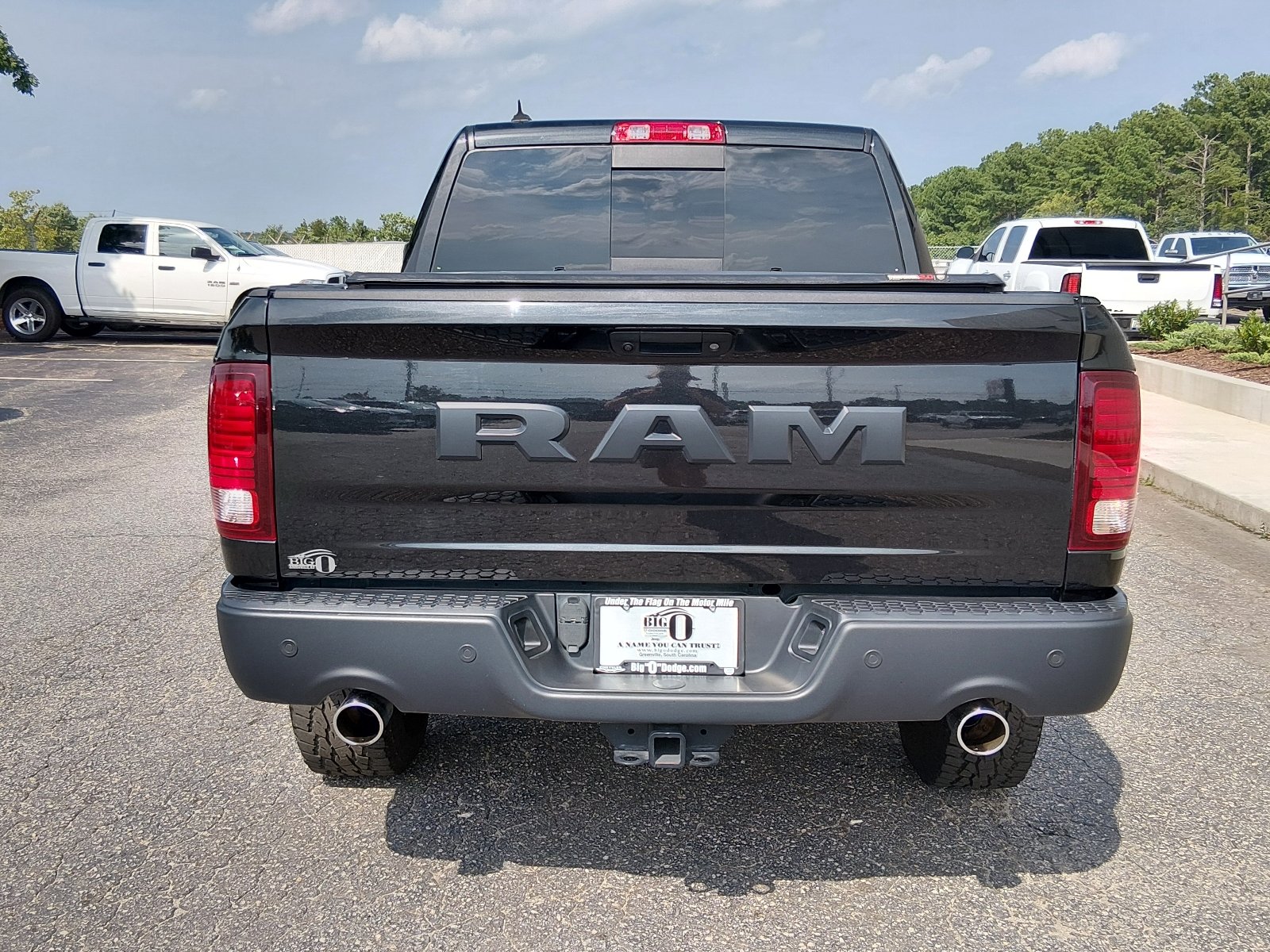 Used 2017 Brilliant Black Crystal Pearl Coat Ram 4x4 Rebel 4dr Crew Cab 5.5 ft. SB Pickup image 4