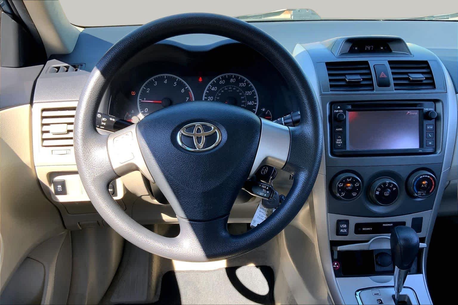 Used 2013 Tropical Sea Metallic Toyota LE image 6
