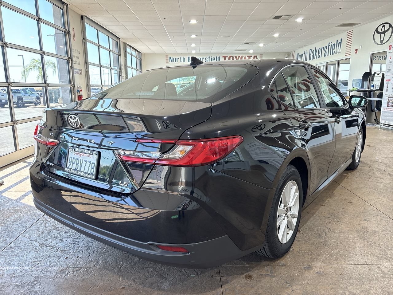 Certified Used 2025 Midnight Black Metallic Toyota LE image 2