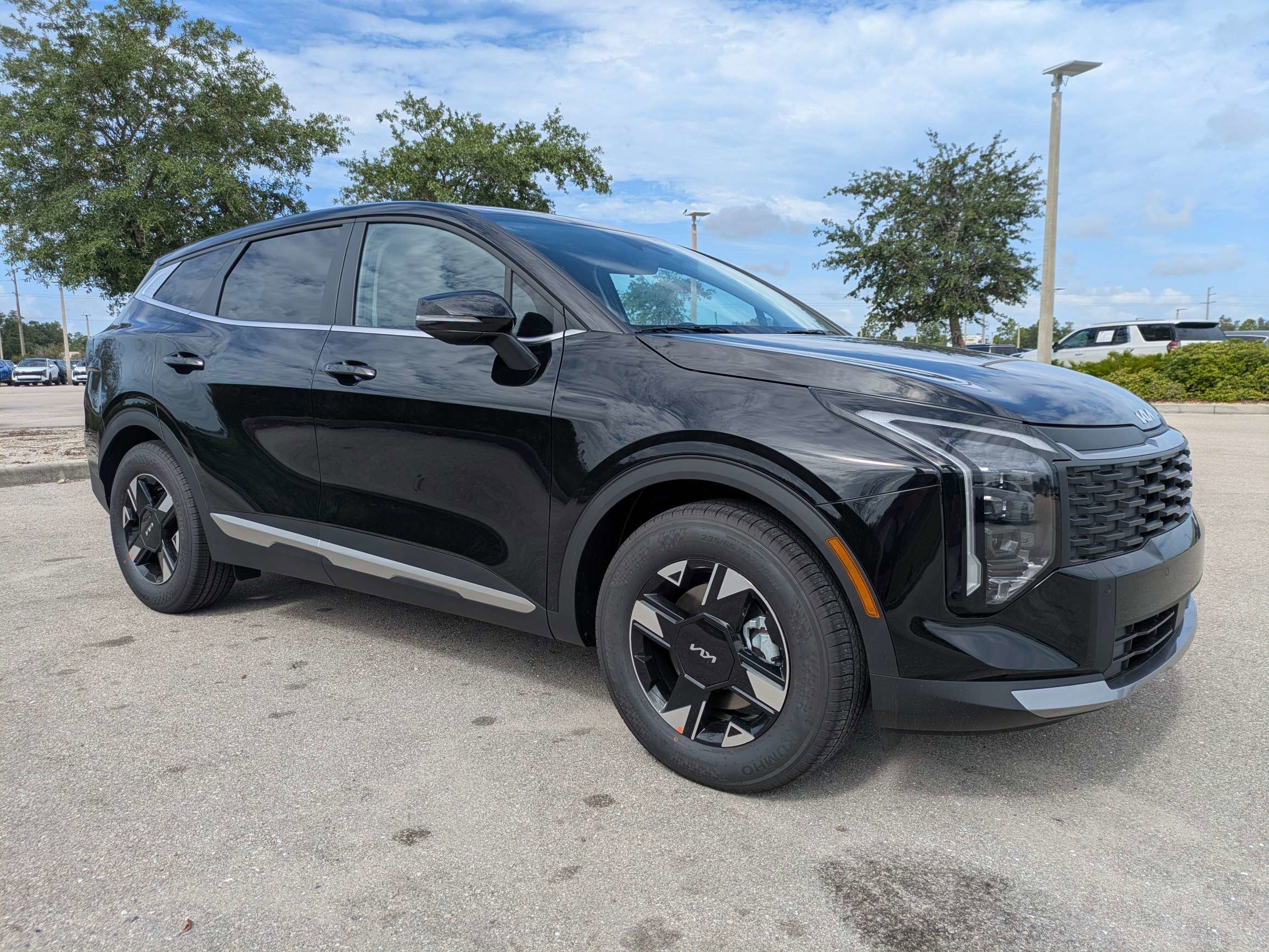New 2026 Ebony Black Kia LX image 2
