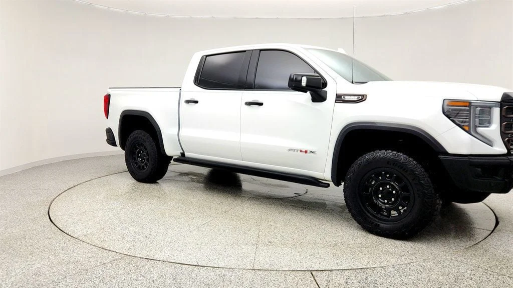 Used 2024 Summit White GMC 4WD Crew Cab 147"" AT4X image 3