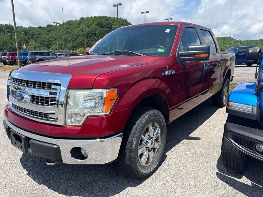 Used 2013 Ruby Red Metallic Ford XLT image 1