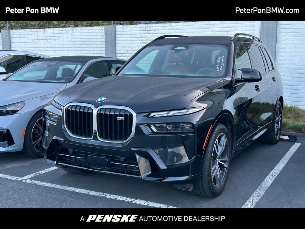 Certified Used 2024 Black Sapphire Metallic BMW M60i image 1