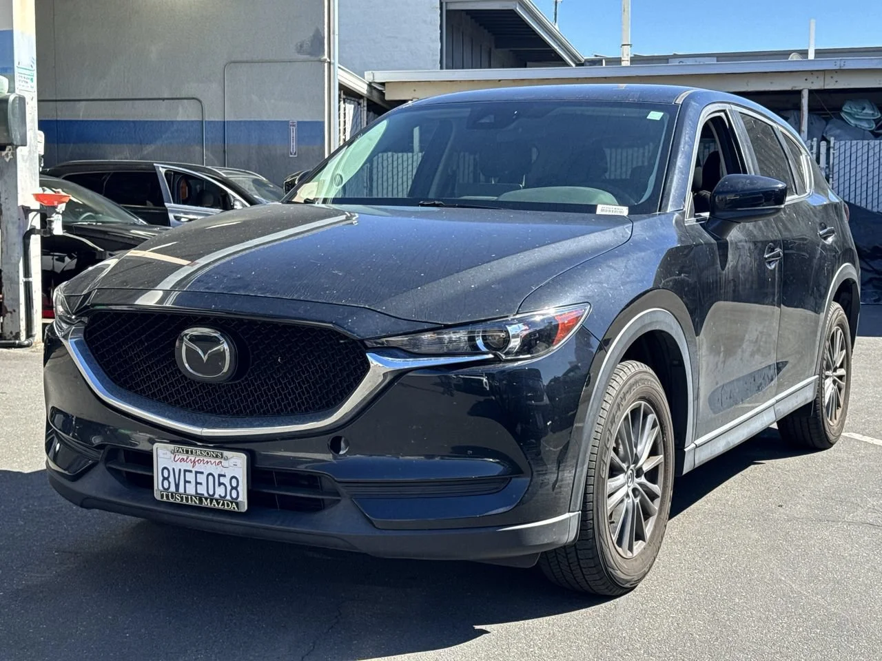 Used 2021 JET BLACK MICA MAZDA TOURING image 2