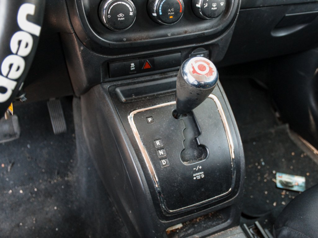 Used 2012 Bright Silver Metallic Clearcoat Jeep Sport image 17