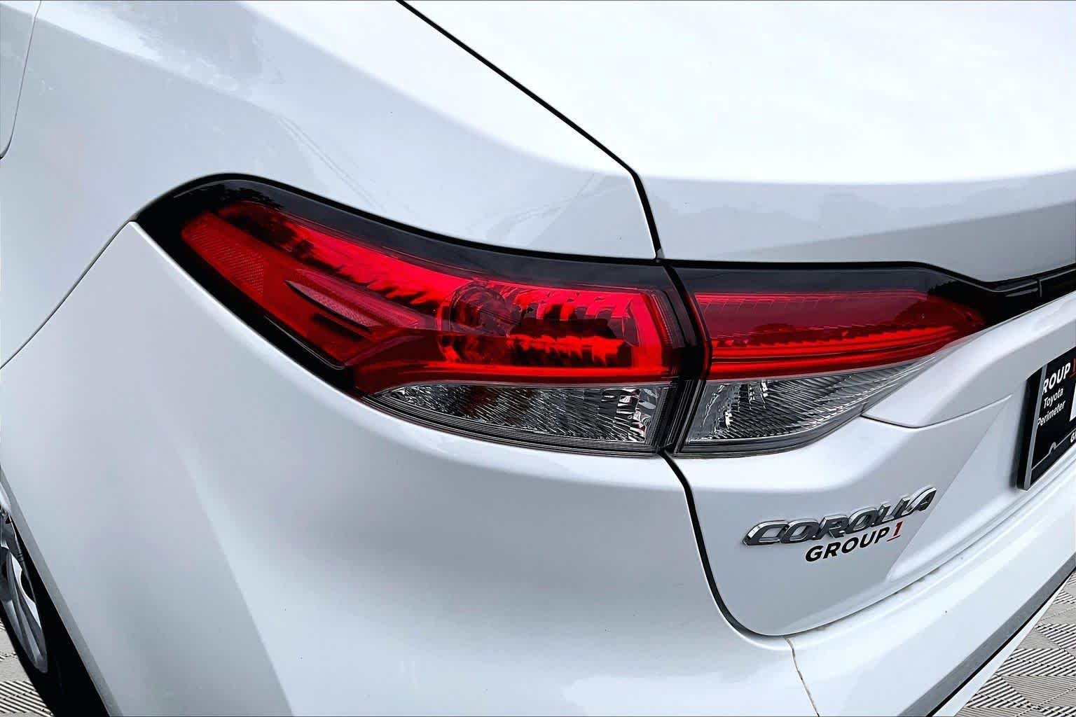 Used 2021 Super White Toyota LE image 29