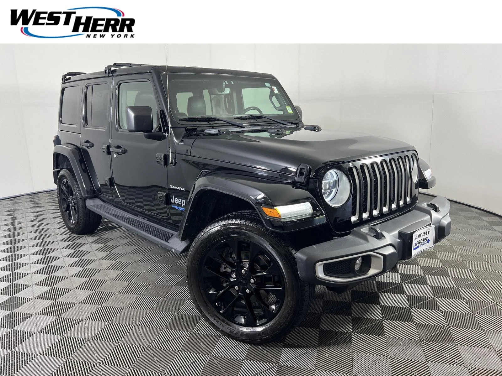 Used 2021 Black Clearcoat Jeep Unlimited Sahara 4xe image 1