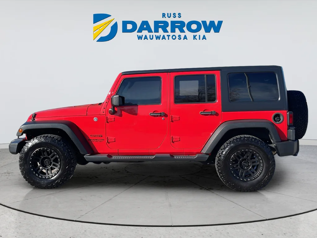 Used 2013 Red Jeep Unlimited Sport image 2