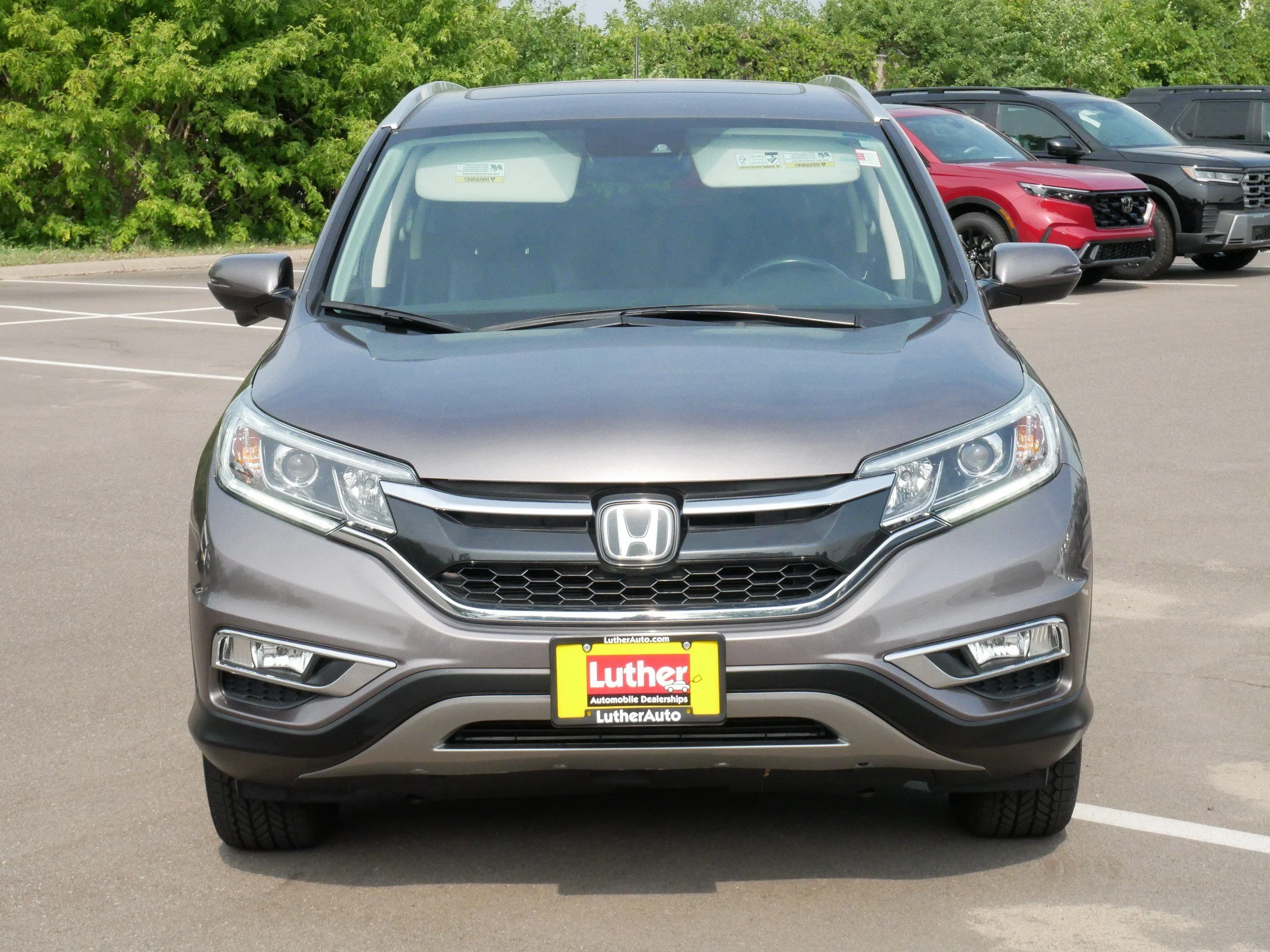 Used 2016 Honda CR-V Touring with VIN 5J6RM4H9XGL105296 for sale in Hopkins, Minnesota