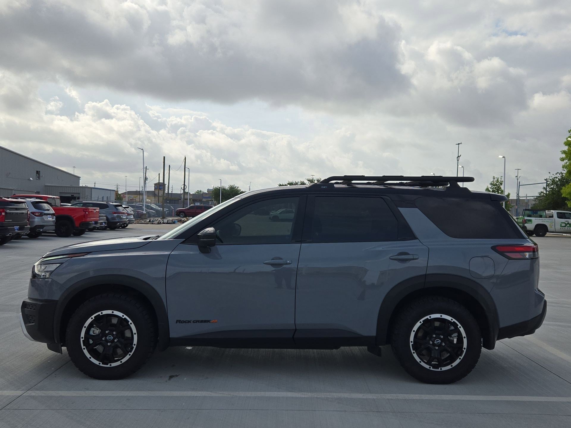 Used 2025 Solid Gray/Super Black Nissan Rock Creek image 6