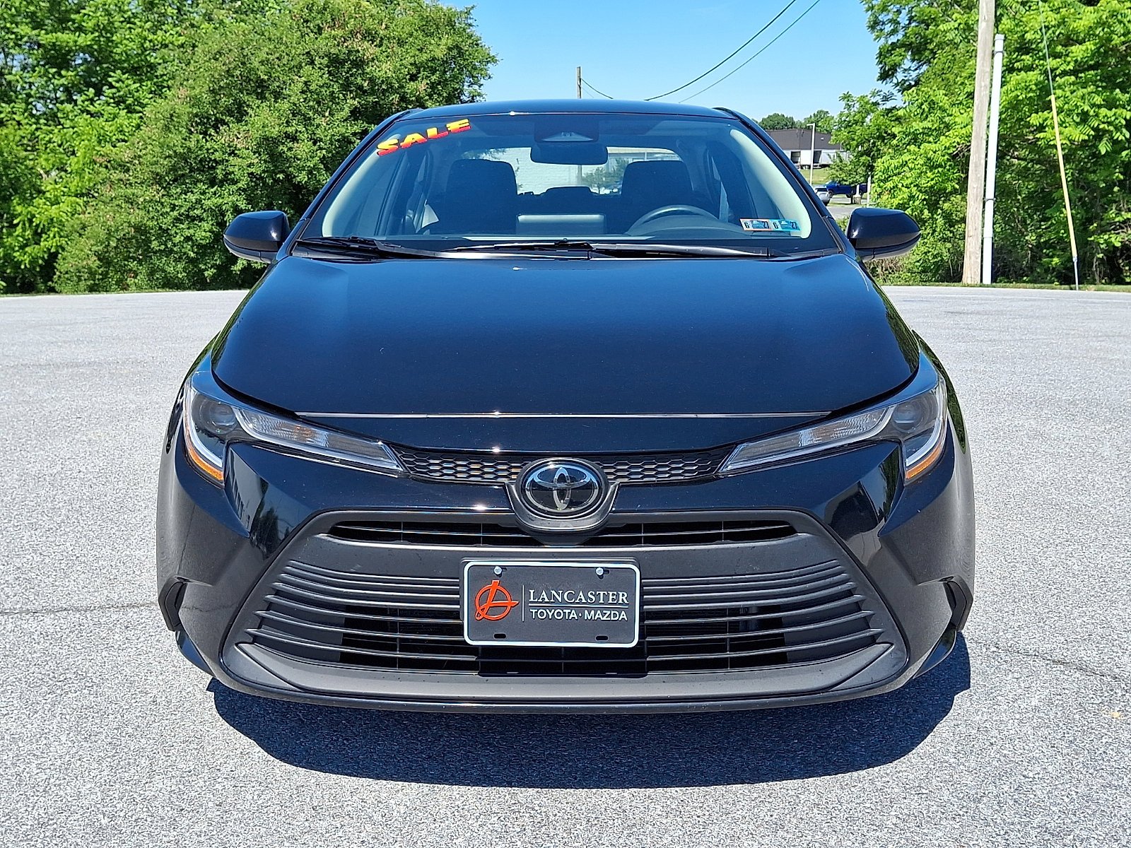 Used 2025 Midnight Black Metallic Toyota LE image 2