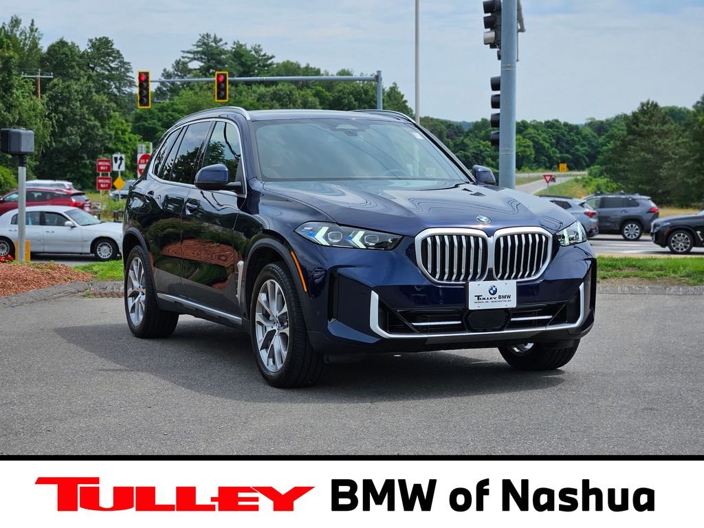 Used 2026 Tanzanite Blue II Metallic BMW xDrive40i image 1