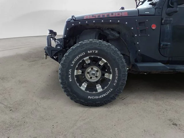 Used 2012 Black Jeep Unlimited Sahara Altitude image 14