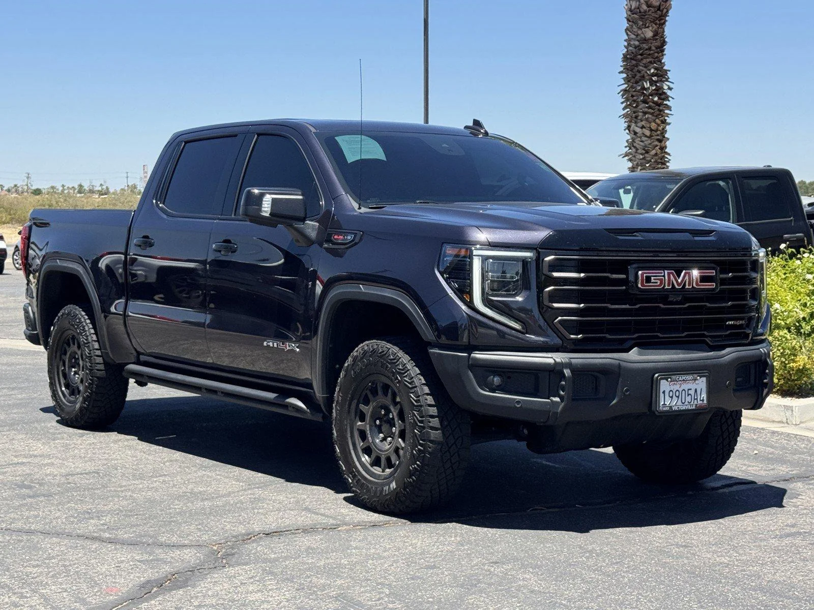 Used 2024 Titanium Rush Metallic GMC AT4X image 1