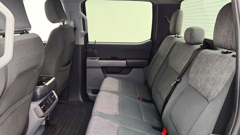 Used 2023 Agate Black Metallic Ford XLT 4WD SuperCrew 5.5