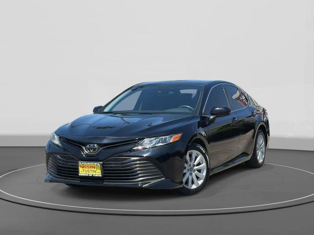Used 2020 Midnight Black Metallic Toyota LE image 1