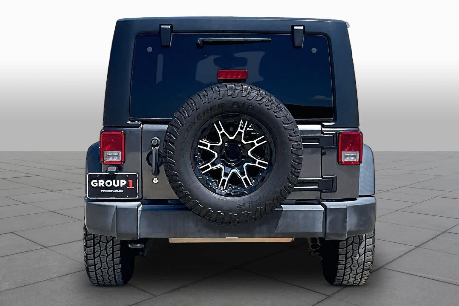 Used 2018 Granite Crystal Metallic Clearcoat Jeep Sport S image 4