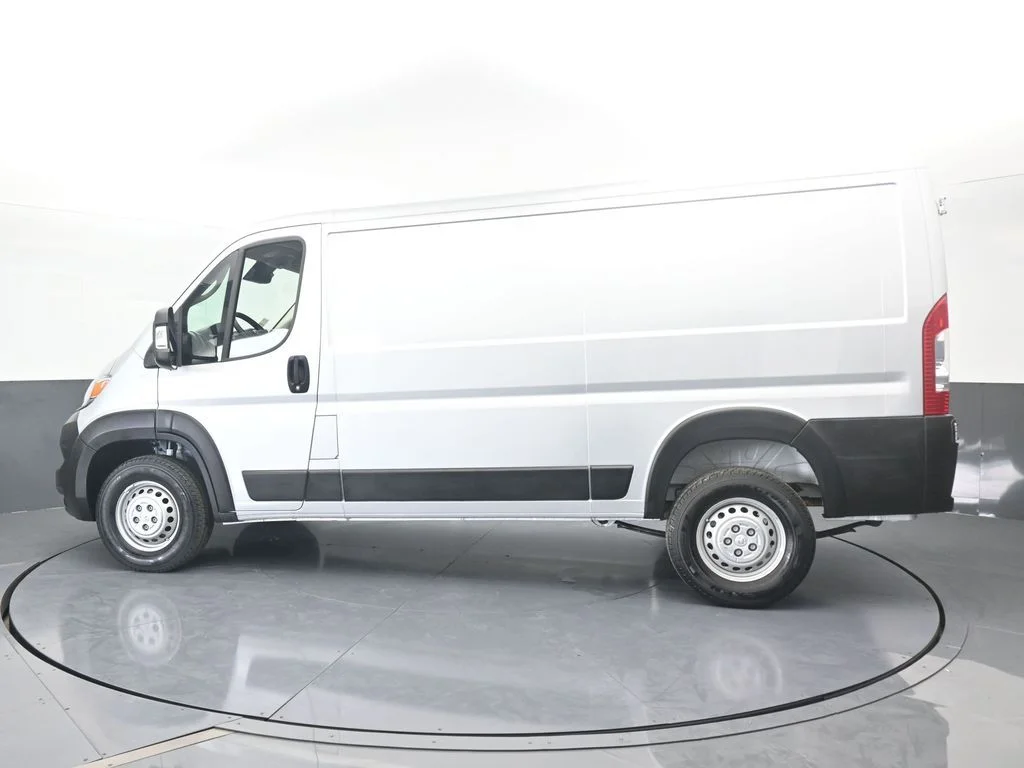 Used 2025 Bright Silver Clearcoat Metallic Ram Low Roof image 3