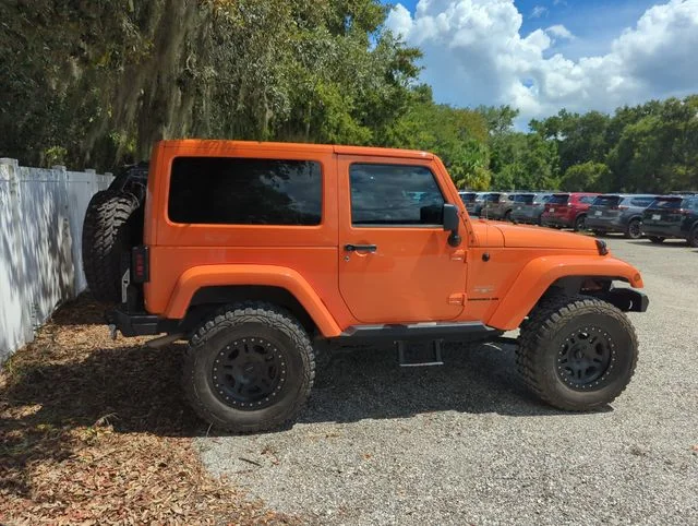 Used 2012 Orange Jeep Sahara image 2