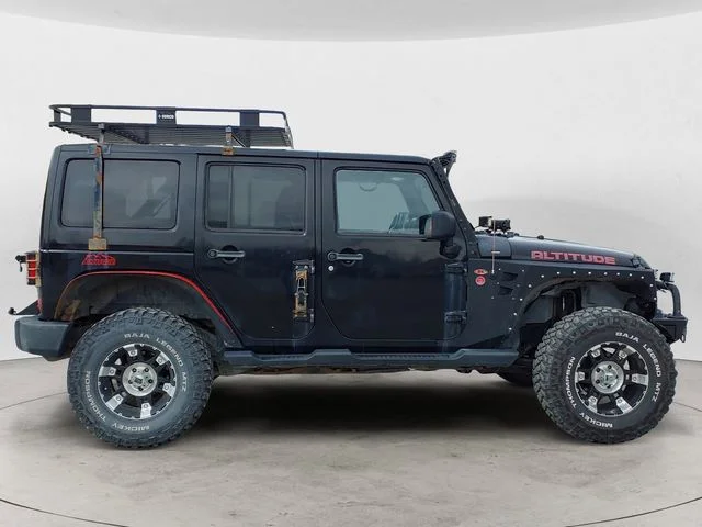 Used 2012 Black Jeep Unlimited Sahara Altitude image 6