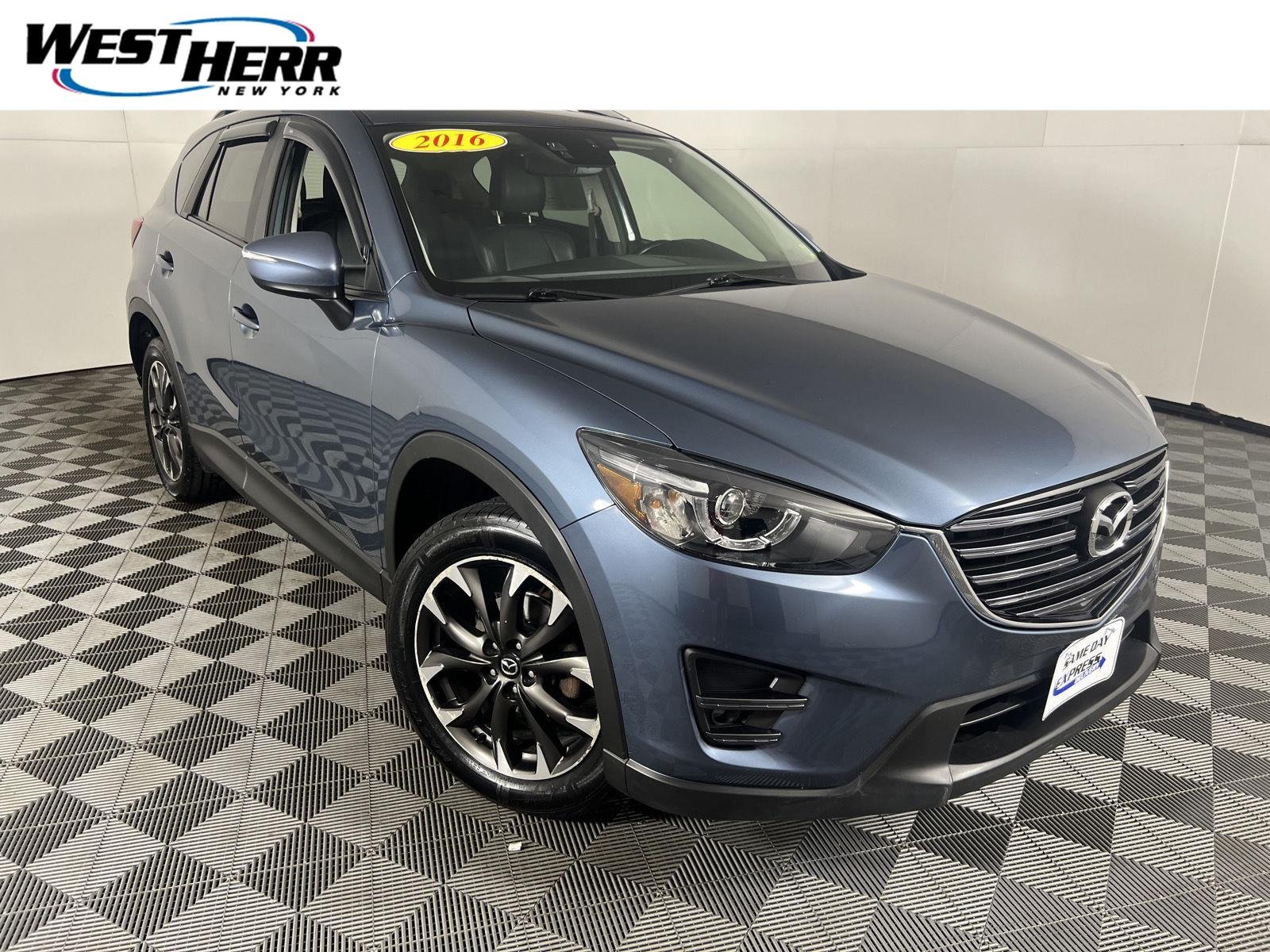 Used 2016 Blue Reflex Mica Mazda Grand Touring image 1