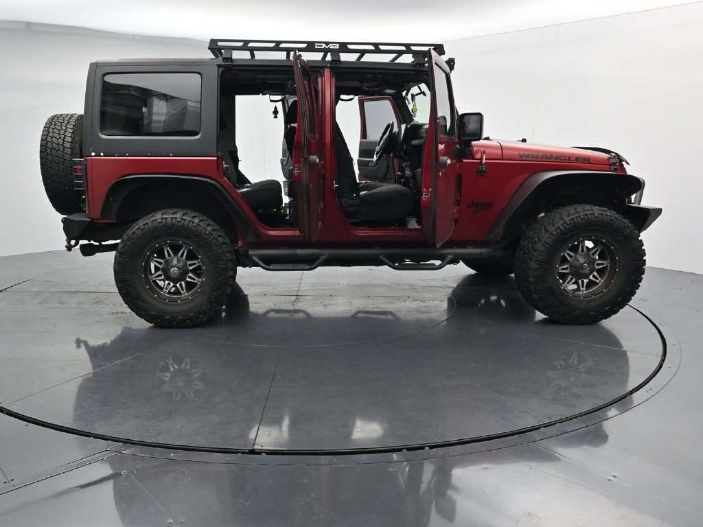 Used 2012 Red Jeep Unlimited Sport image 27