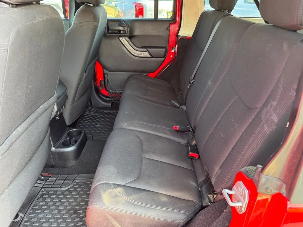 Used 2014 Red Jeep Unlimited Sport image 10
