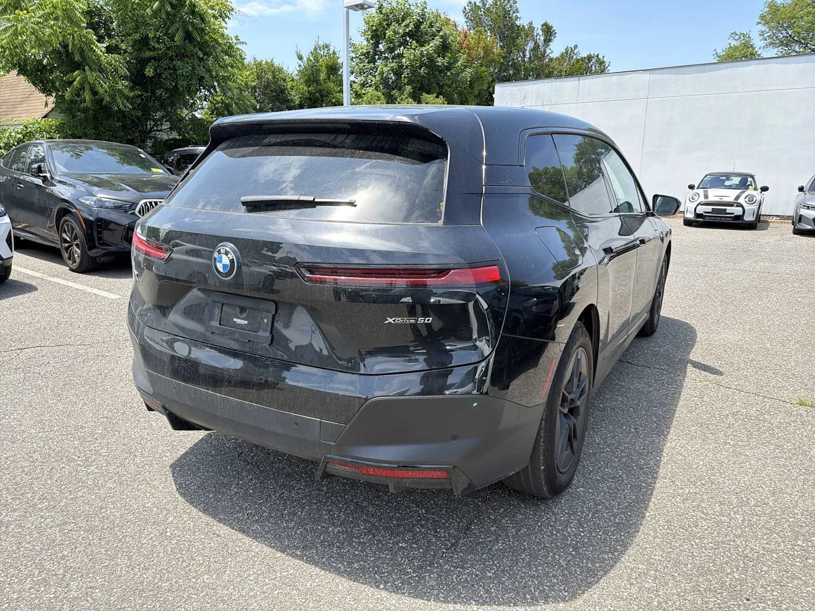 Used 2024 Black Sapphire Metallic BMW xDrive50 image 6