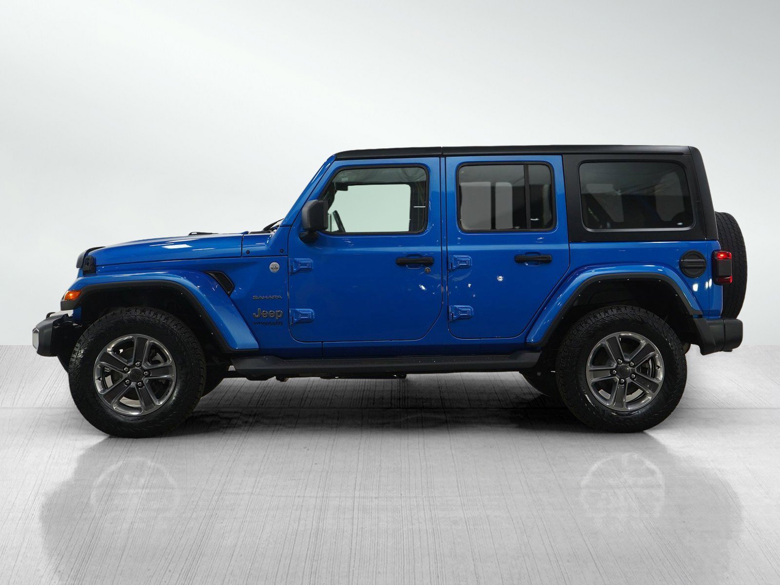 Used 2022 Jeep Wrangler Unlimited Sahara with VIN 1C4HJXEG2NW106274 for sale in Minneapolis, Minnesota