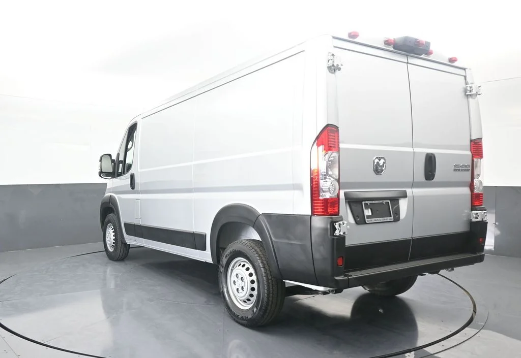 Used 2025 Bright Silver Clearcoat Metallic Ram Low Roof image 4