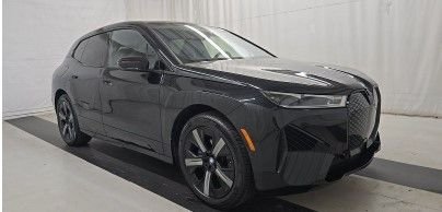 Used 2024 Black BMW xDrive50 image 1
