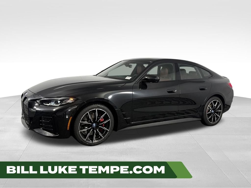 Used 2023 Black Sapphire Metallic BMW eDrive40 image 1