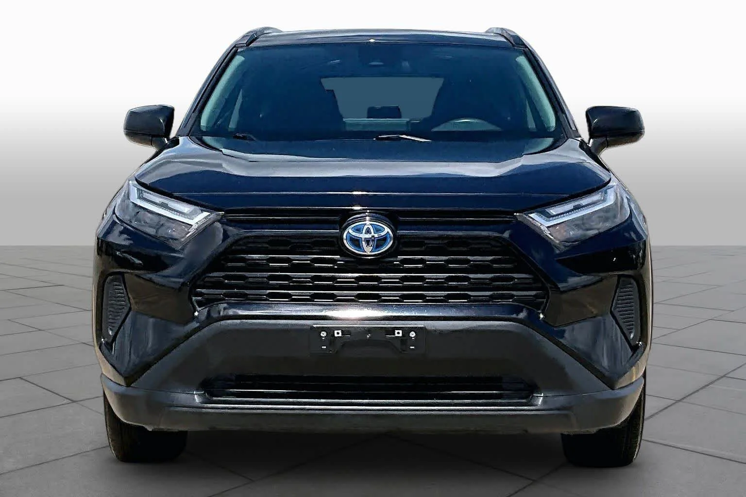Used 2024 Midnight Black Metallic Toyota Hybrid LE image 4