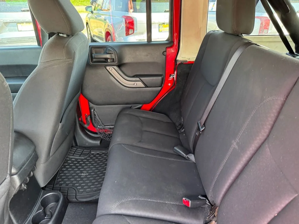 Used 2014 Red Jeep Unlimited Sport image 8