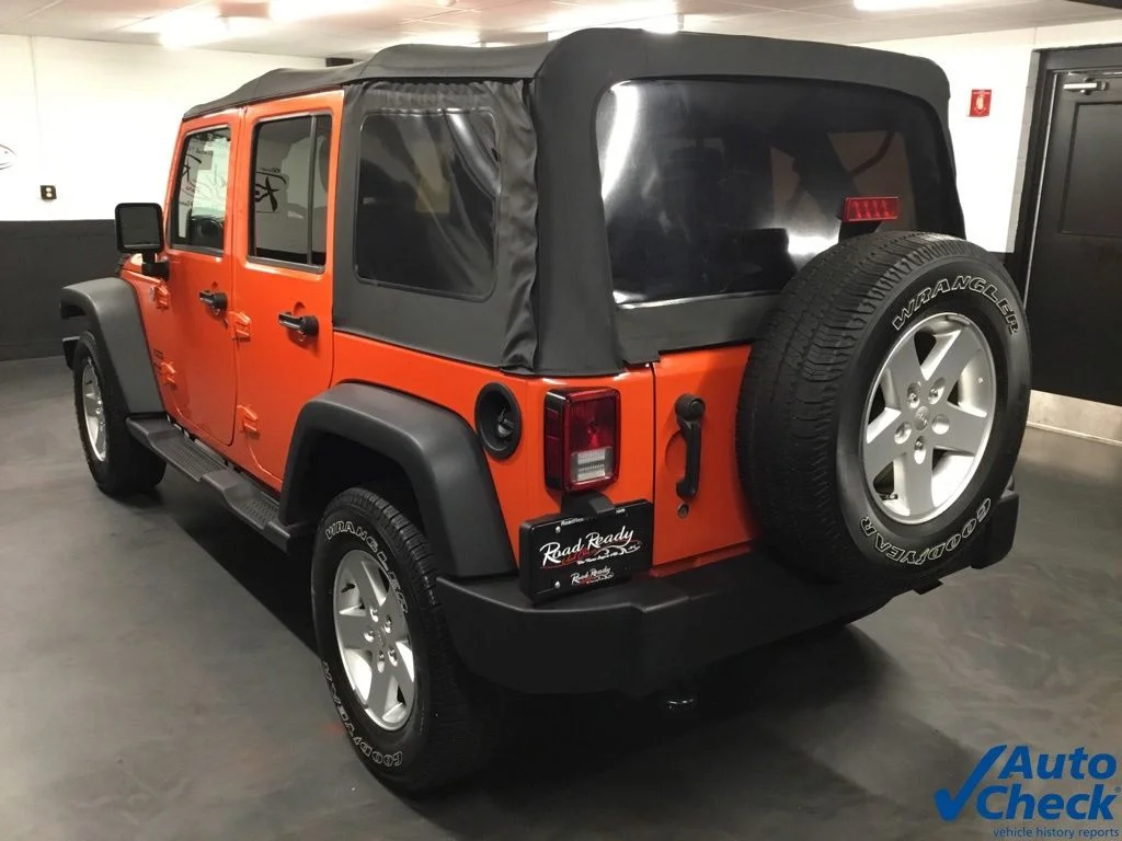 Used 2015 Orange Jeep Unlimited Sport image 7