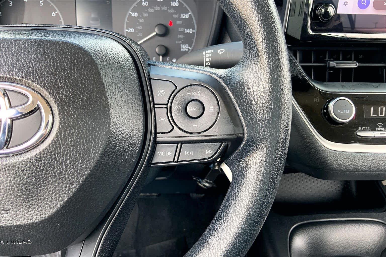 Used 2024 Midnight Black Metallic Toyota LE image 24