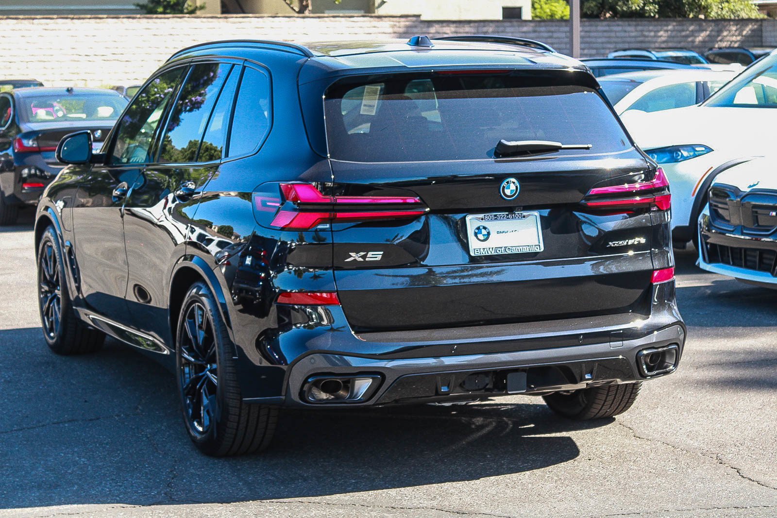 New 2026 Black Sapphire Metallic BMW xDrive50e image 4