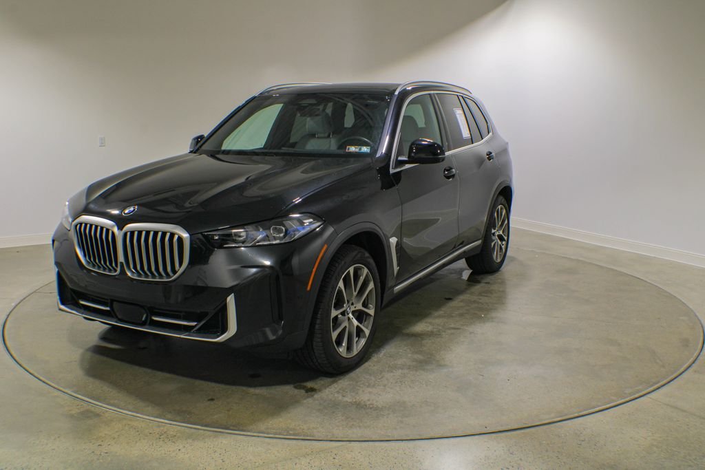Used 2024 Black Sapphire Metallic BMW xDrive40i image 1