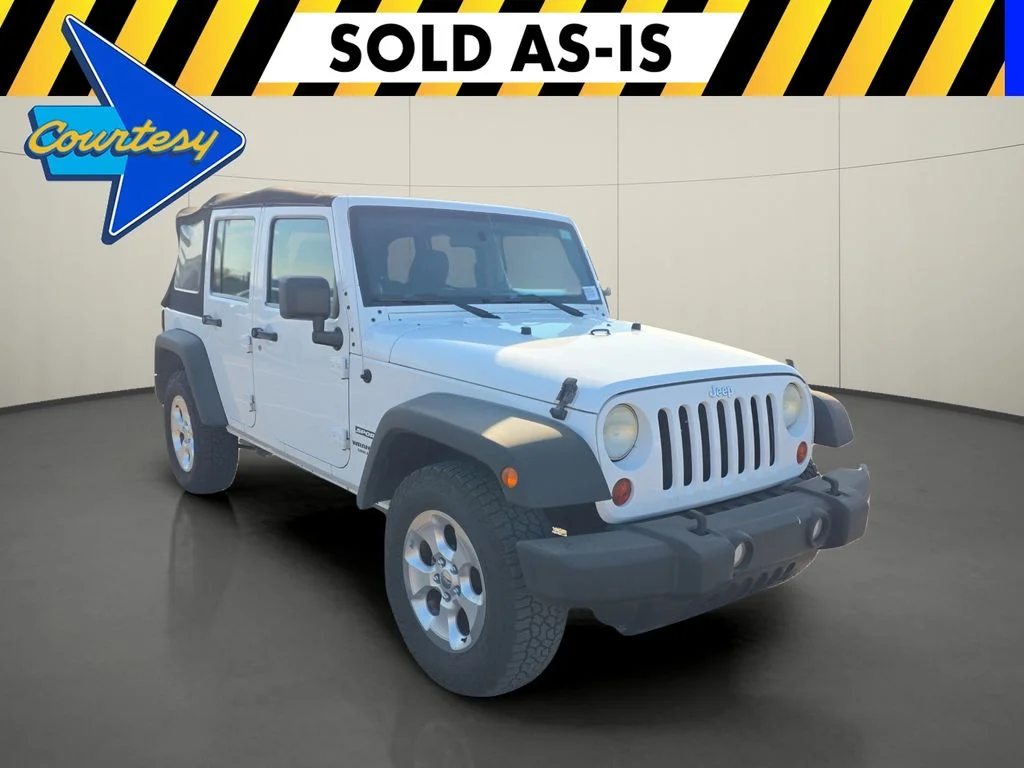 Used 2013 White Jeep Unlimited Sport image 1