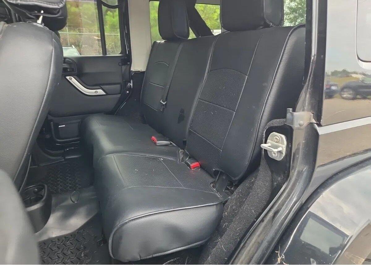 Used 2014 Black Clearcoat Jeep Sahara image 8