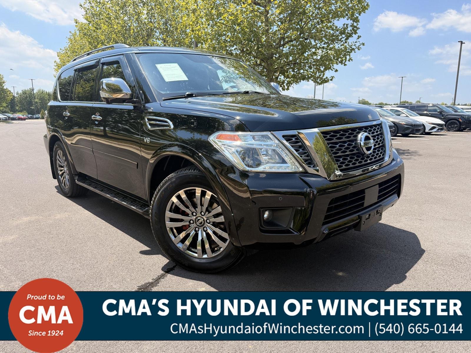Used 2018 Super Black Nissan Platinum image 1