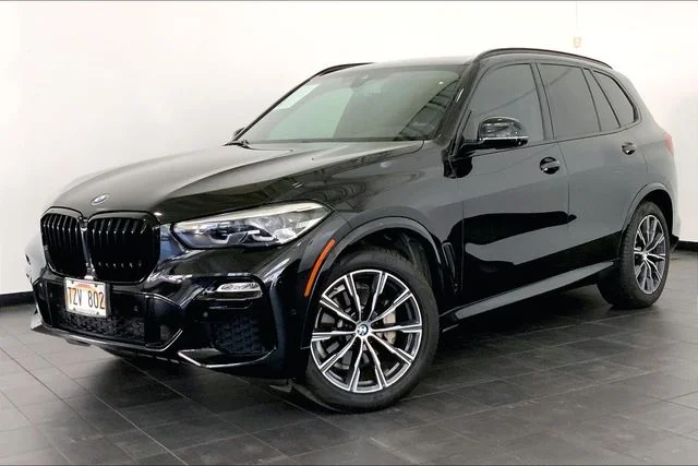 Used 2020 Black Sapphire Metallic BMW sDrive40i image 1