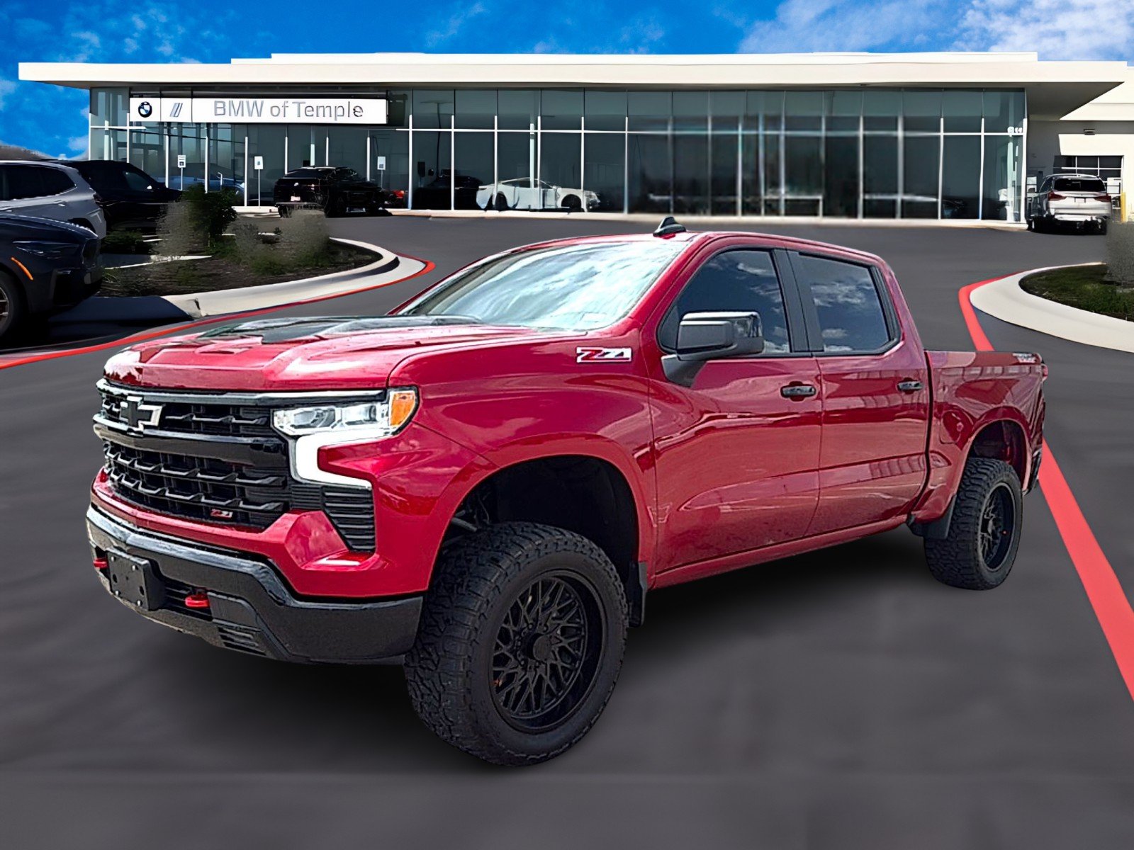 Used 2025 Radiant Red Tintcoat Chevrolet 4WD Crew Cab Short Bed LT Trail Boss image 1