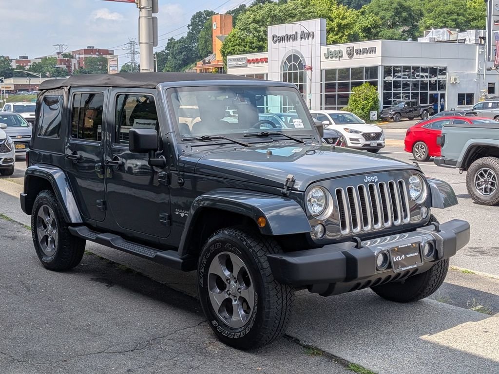 Used 2016 Black Jeep Unlimited Sahara image 4