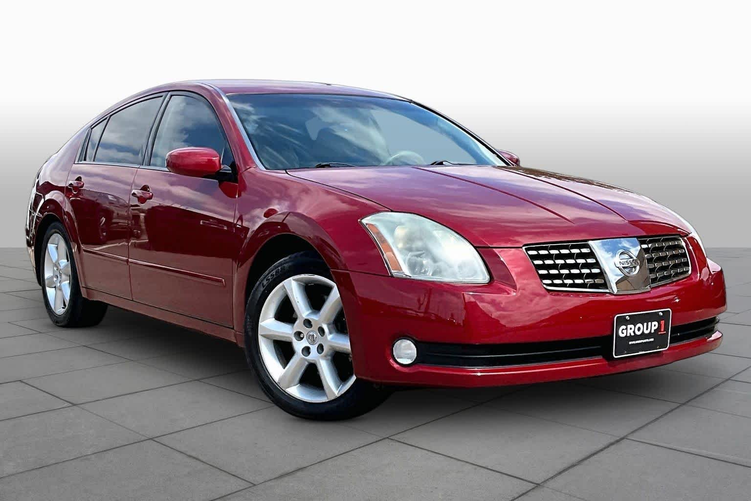 Used 2004 Red Opulence Metallic Nissan SE image 2