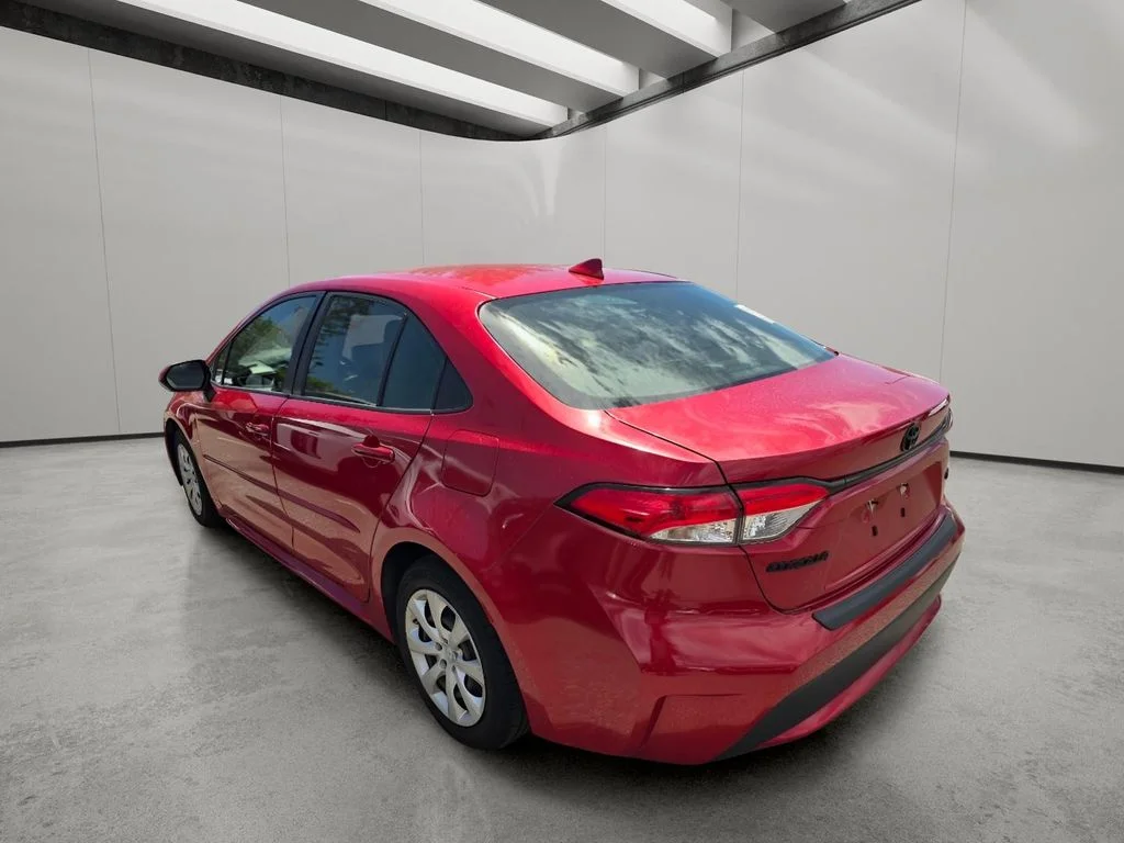 Used 2021 Barcelona Red Metallic Toyota LE image 6